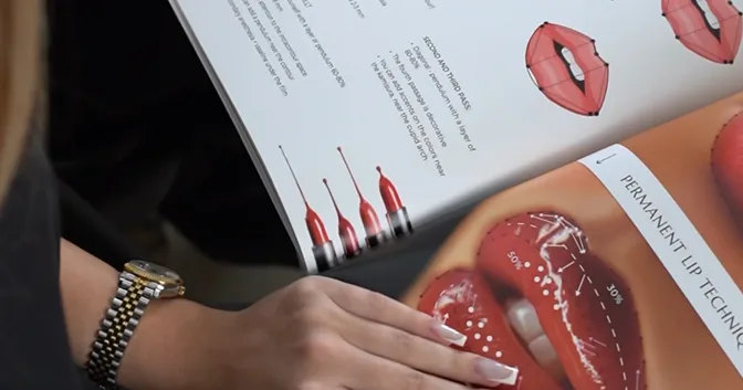 A student reading the printed course workbook
